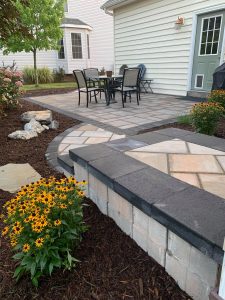 Hardscaping with stone tile and firepit for backyard of Mechanicsburg PA home